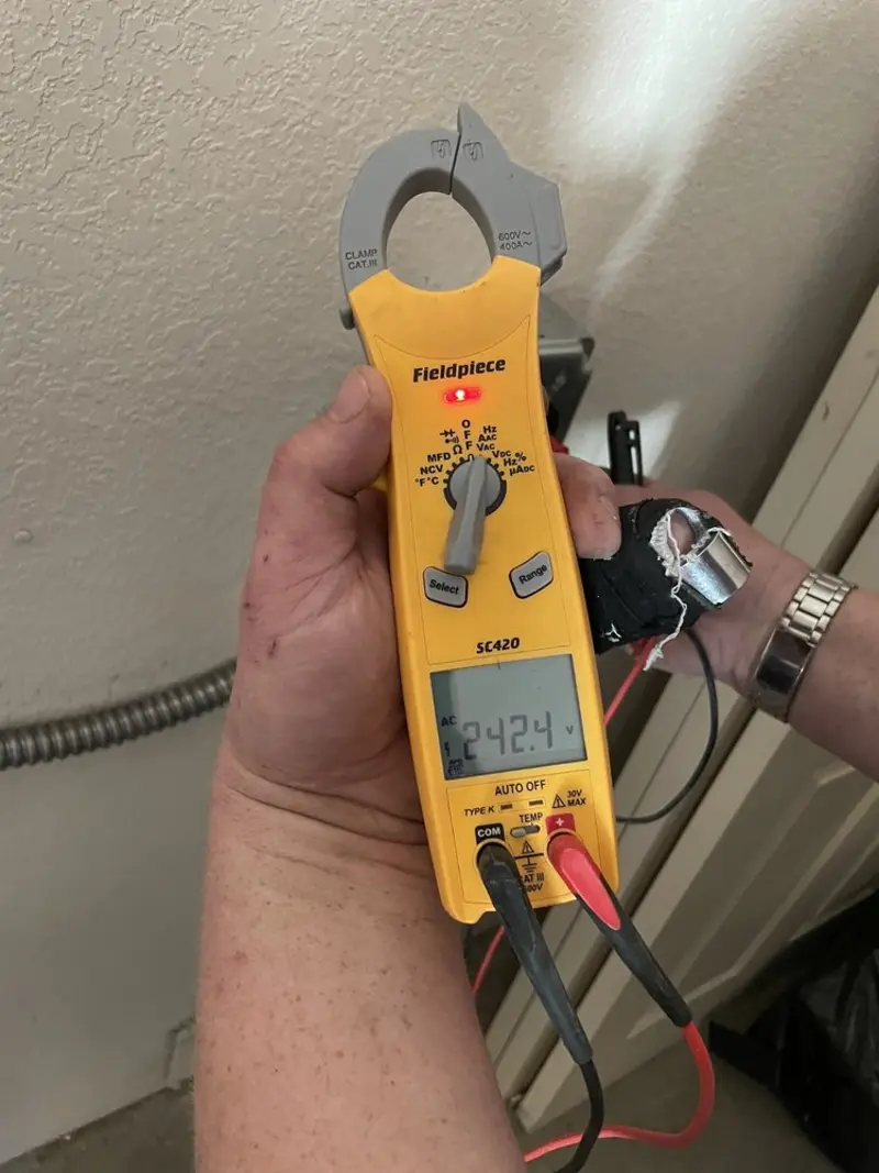 Voltage testing with clamp meter during Recessed Lighting Installation in Ewing